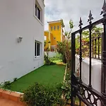 House With A Tropical Garden