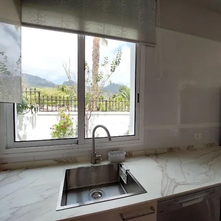 House With A Tropical Garden